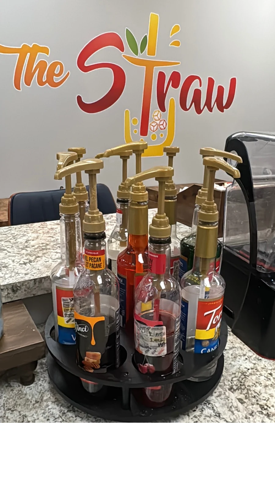 Flavor syrups ready at The Straw counter